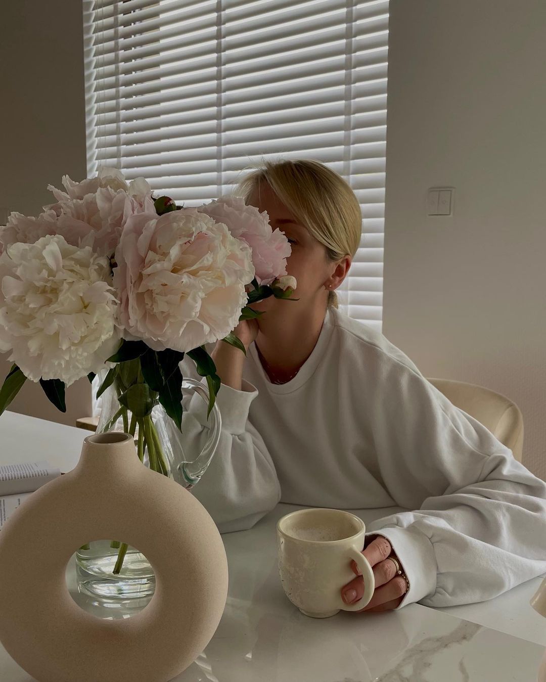 Woman sniffing flower